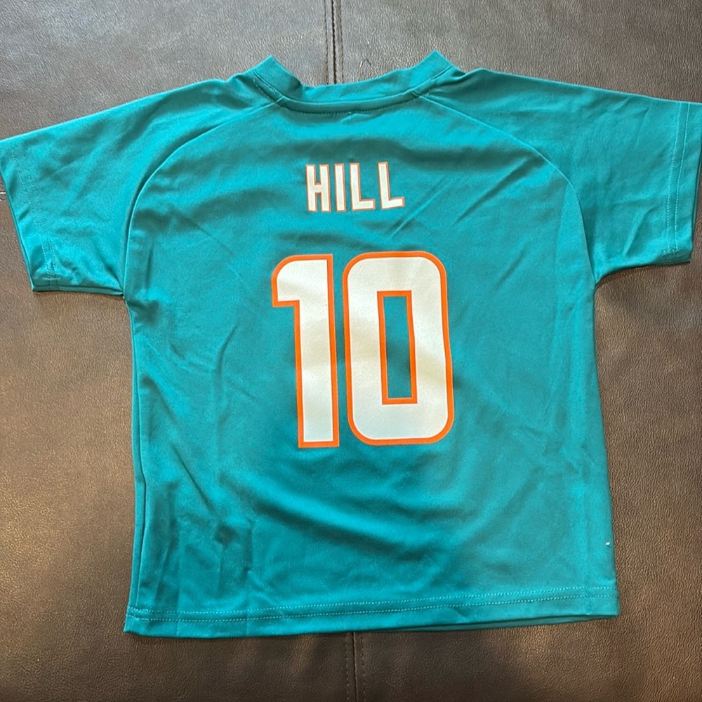 New and Never been worn. NFL size youth5/6 Dolphins NFL Jersey Hill